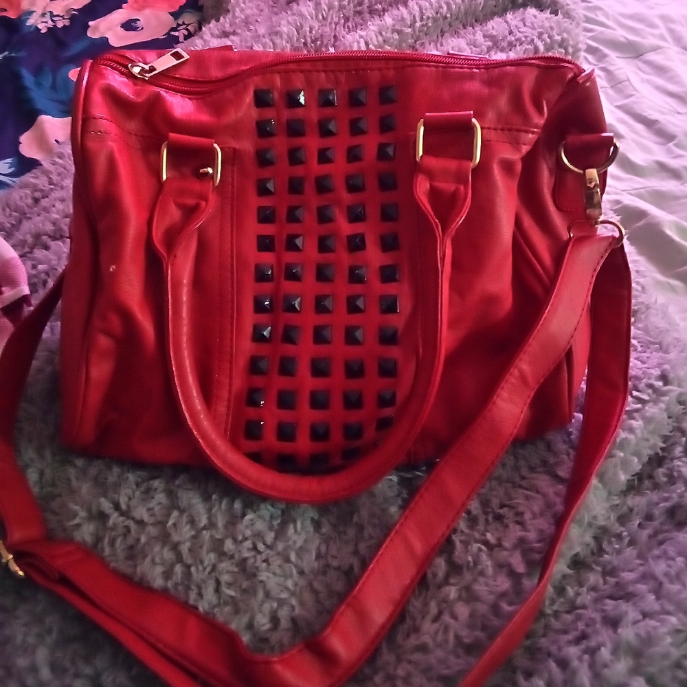 Red purse with black studs